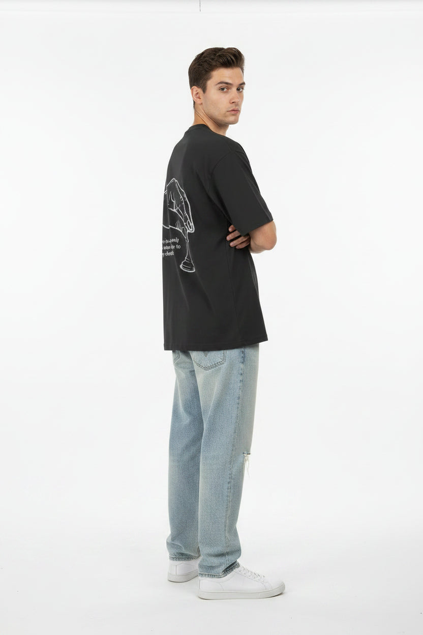 Black t-shirt with a white graphic and text on the back, displayed against a light gray background.