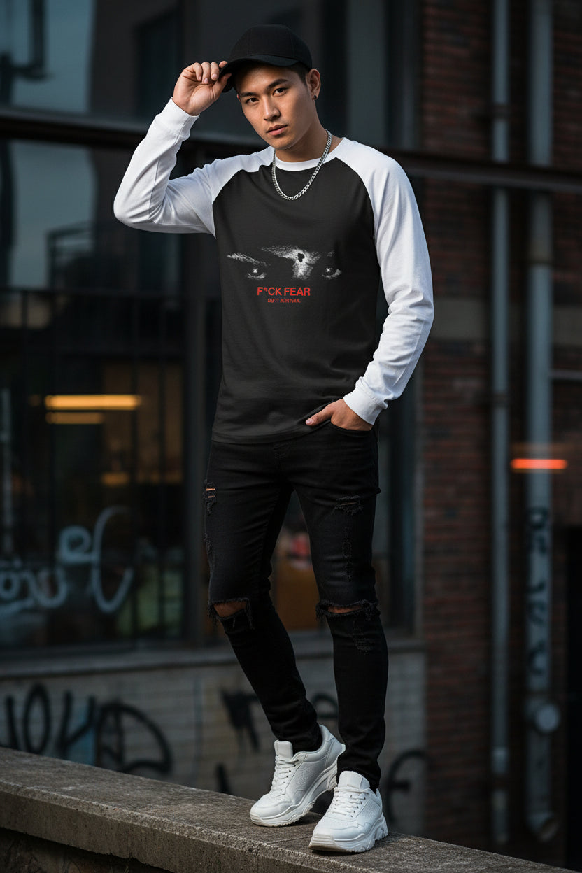 Long-sleeve shirt with a graphic of a cat's face and text on a white background