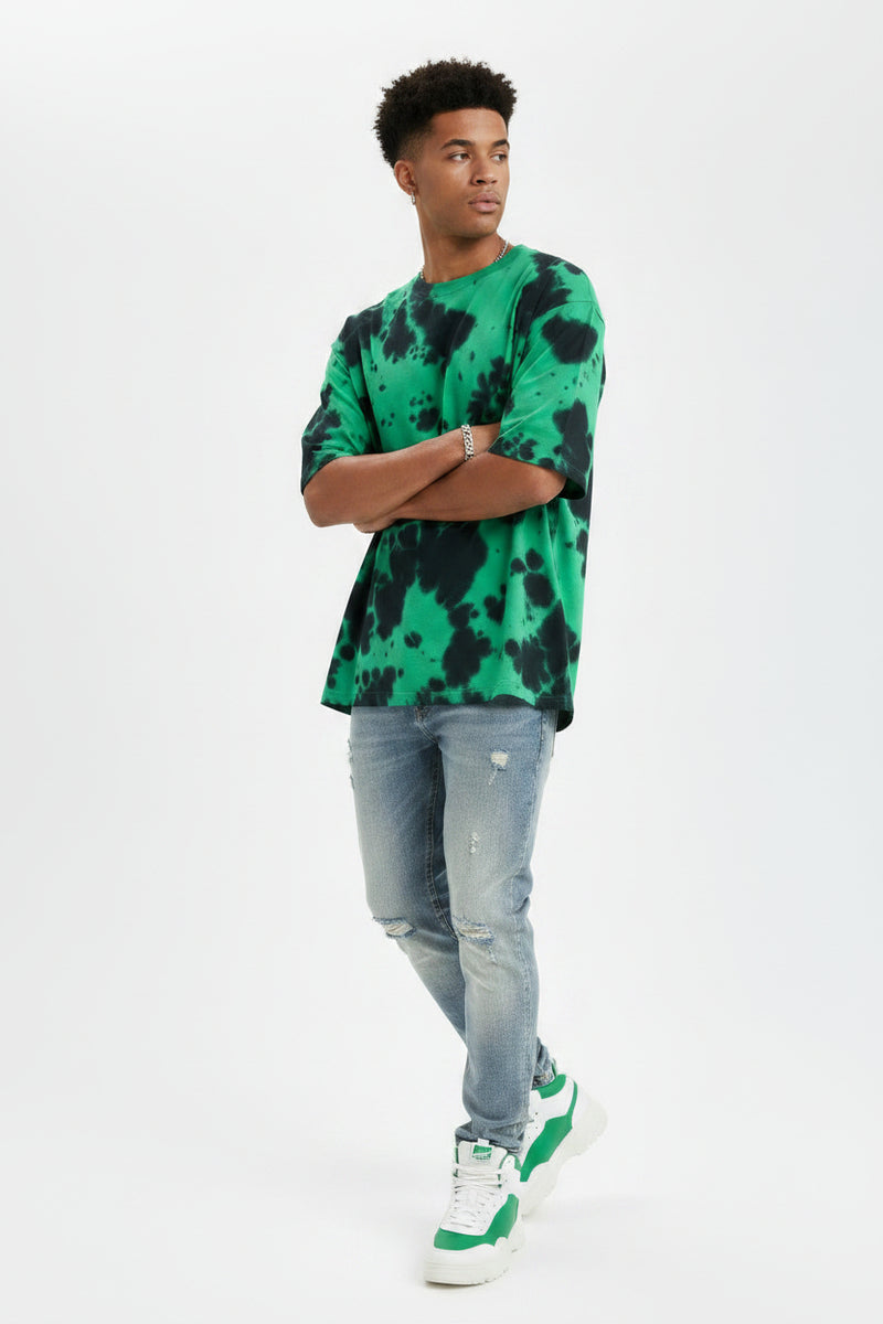 Green and black tie-dye t-shirt on a white background